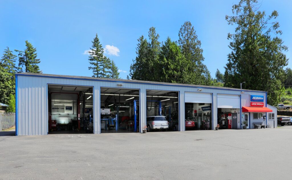 Local Wrench Auto Repair shop visible from the front approach on a sunny day in Belfair, WA